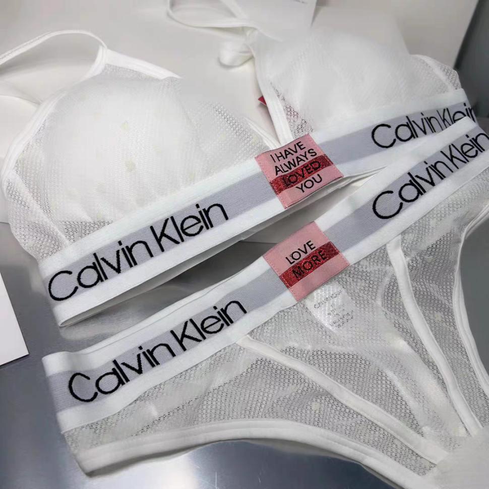 Женский комплект Calvin Klein в сеточку белый: топ и стринги CA21