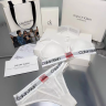 Женский комплект Calvin Klein в сеточку белый: топ и стринги CA21